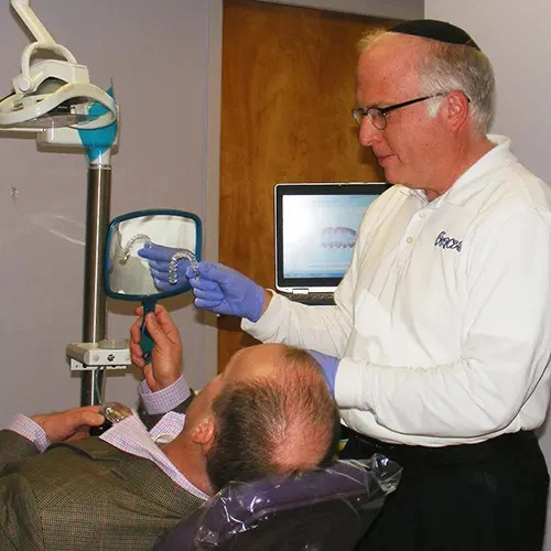 Orthodontist David Schneeweiss With Patient
